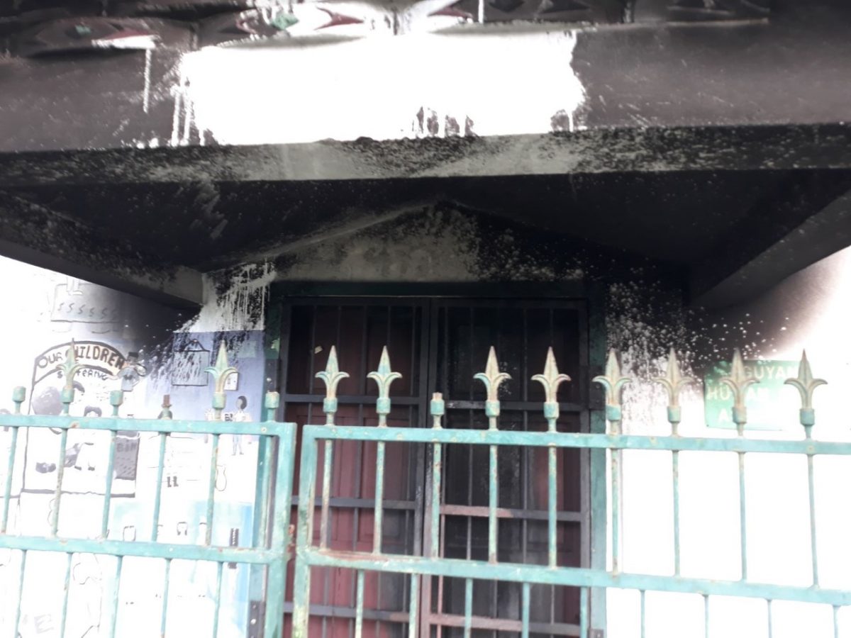 The damaged front door of the GHRC building