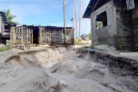 Homes that are clinging to their foundation following the mudslide due to rain over the weekend. 