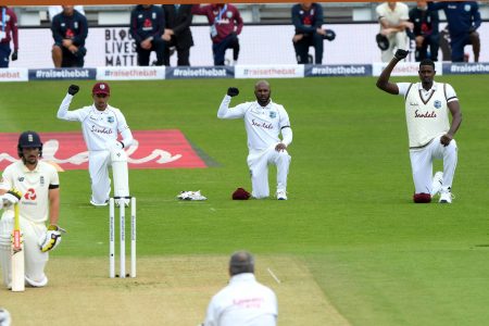 West Indies and England players show their support for the Black Lives matter movement prior to the start of the first test yesterday. (Photo courtesy CWI)
