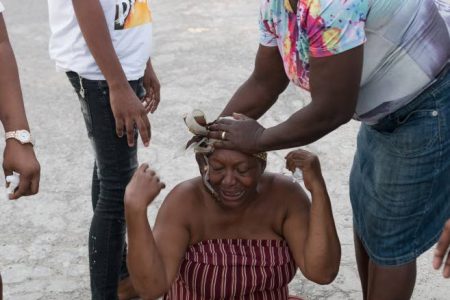 Winsome Beckford, grandmother of Kashane and Rashane Ferguson, is comforted by family friends Ashani Stewart (left) and Eucina Dawkins as she mourns the boys’ drowning death in the Rio Cobre on Sunday.