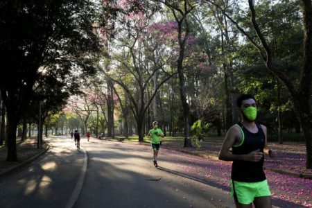 People run at Ibirapuera Park after it was reopened as the city eases the restrictions imposed to control the spread of the coronavirus disease (COVID-19), in Sao Paulo, Brazil July 13, 2020. REUTERS/Amanda Perobelli
