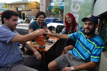 CHEERS: Patrons enjoy drinks at Pub House on Ariapita Avenue, Port of Spain, yesterday. —Photo: ISHMAEL SALANDY