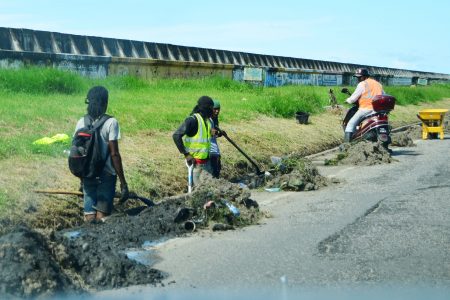 The drain along the seawall from Subryanville and further east was cleared of weeds and rubbish. Rain usually leads to flooding of the carriageway and the cleaning of the drains could likely alleviate this. (Orlando Charles photo)
