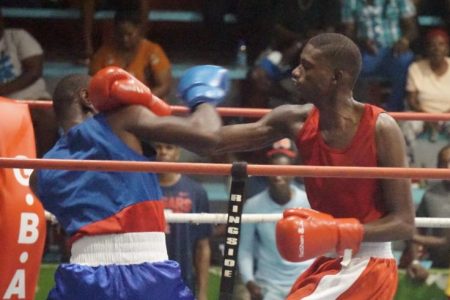 Top boxer, Colin Lewis (right), still has his sights set on clinching an Olympic berth. (Emmerson Campbell photo)
