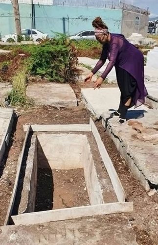 Jimmy Jackson’s mother looks on in horror at the spot where she had laid her son 25 years ago. The family says that the remains have disappeared from the grave.