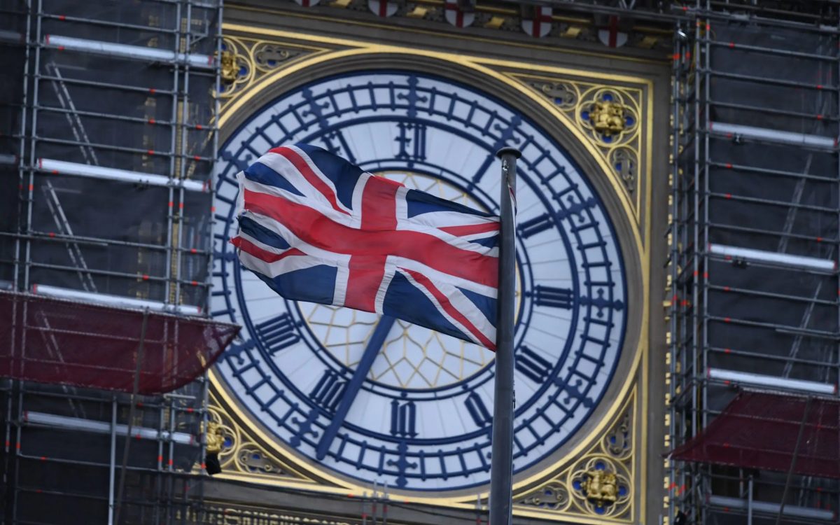 The Union flag flutters near the clock face of Big Ben during ongoing renovations to the Tower and the Houses of Parliament, in central London. (Photo: AP)