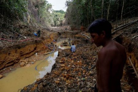 FILE PHOTO: A Yanomami indian follows agents of Brazil’s environmental agency in a gold mine during an operation against illegal gold mining on indigenous land, in the heart of the Amazon rainforest. (Reuters photo)
