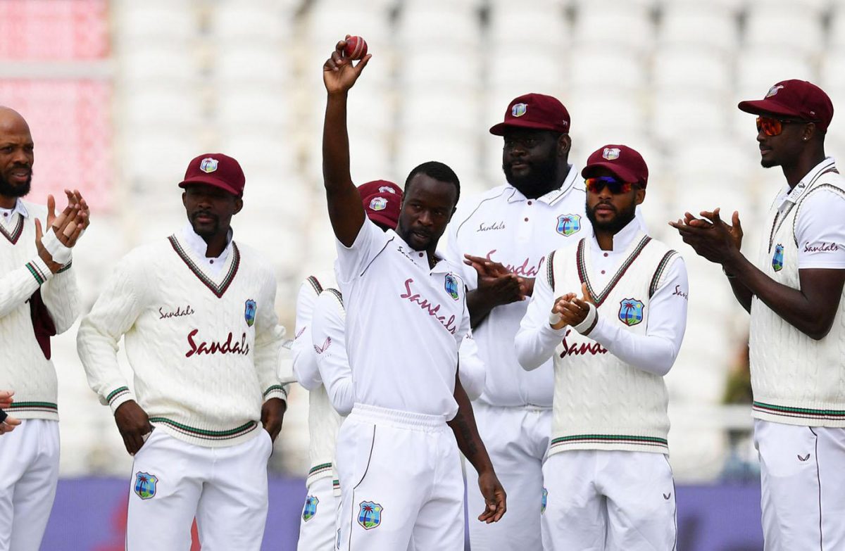 Kemar Roach celebrates reaching his 200th wicket in Tests on the second day of the Old Trafford third Test.

