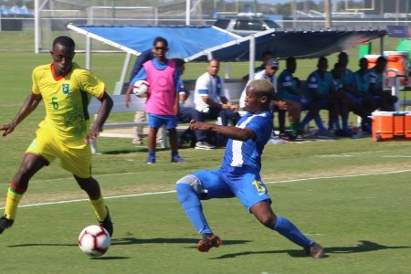 Flashback- Lionel Holder [no.6] of Guyana trying to evade the impending challenge of Rogyear Anita [right] of Curacao at the IMG Academy, Florida, USA in the CONCACAF Men’s U20 Championship.
