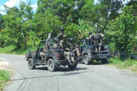 Members of the Jamaica Defence Force on an operation in Amity, St James, on Wednesday following the fatal shooting of Delano 'Prekeh Boy' Wilmot.