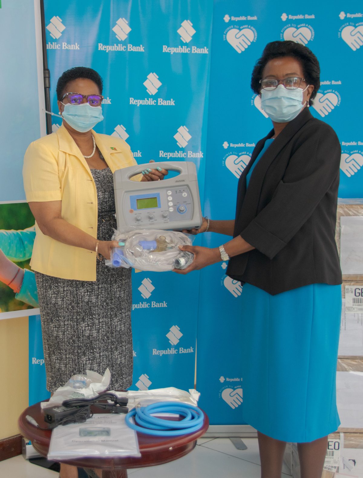 De facto Minister of Public Health Volda Lawrence (left) receiving the donation. (Ministry of Public Health photo) 

