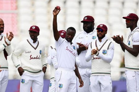 Seamer Kemar Roach celebrates reaching 200 wickets in Tests after dismissing Chris Woakes on the second day of the third Test here yesterday.
