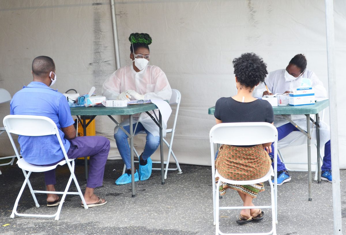Persons being screened by health workers