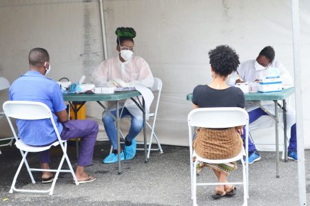 Persons being screened by health workers