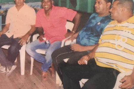 Anil Persaud (left) and Seemangal Yadram (second left) with other members of the Enterprise Legends side at a team’s function. 