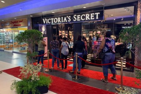 Customersoutside Victoria's Secret's first store in T&T which opened in Gulf City on Friday.
