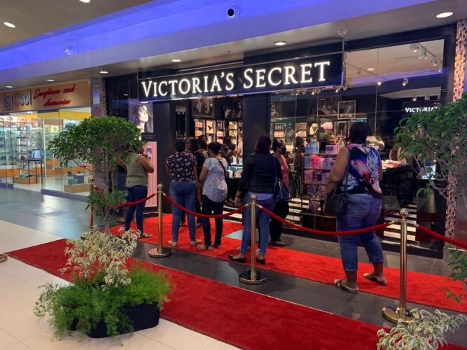 Customersoutside Victoria's Secret's first store in T&T which opened in Gulf City on Friday.