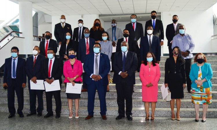 President Irfaan Ali (fifth from left in front row) and Prime Minister Mark Phillips (sixth from left in front row) with the new ministers. (Orlando Charles photo)