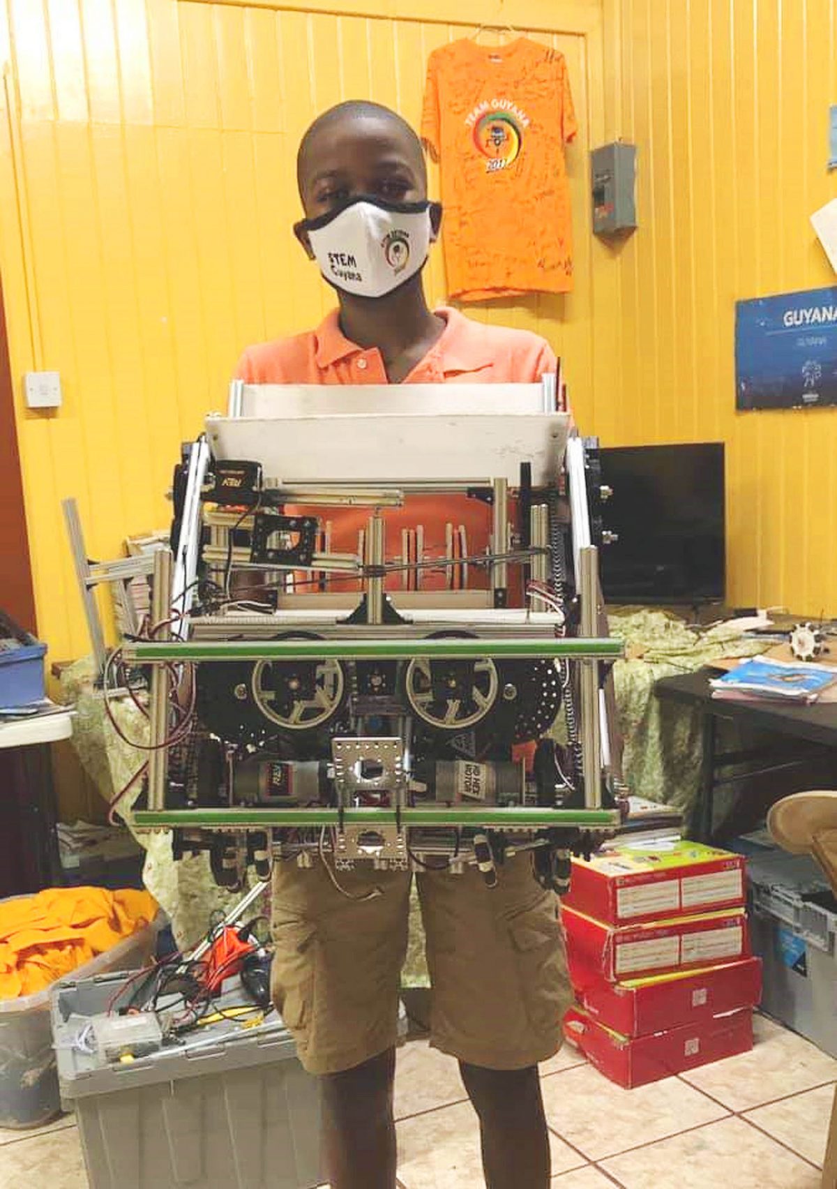 Aspiring scientist Keeland Cummings posing with a robot kit to be used in a major new project