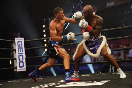 Osvaro David Morrell, left, on the attack against Guyana’s Lennox `Two Sharp’ Allen Saturday night in their boxing elimination bout for the right to challenge for the WBA super middleweight title.
