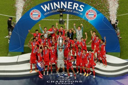 General view as Bayern Munich players celebrate winning the Champions League with the trophy, as play resumes behind closed doors following the outbreak of the coronavirus disease (COVID-19) Manu Fernandez/Pool via REUTERS