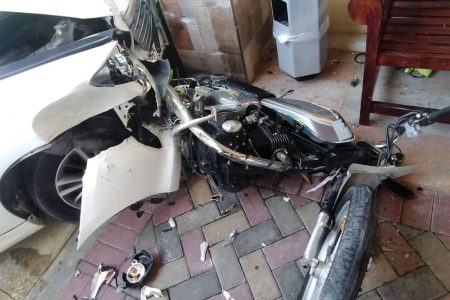 The mangled wreckage of a motorcycle that was rammed by a motorist who foiled a robbery attempt on Wednesday. Both attackers were captured.
