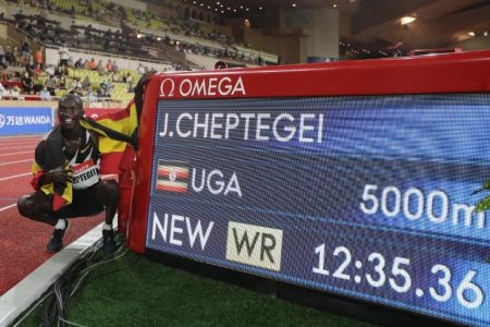 Uganda’s Joshua Cheptegei celebrates after setting a new record in the men’s 5000m at the Monaco Diamond League yesterday. (Reuters photo)
