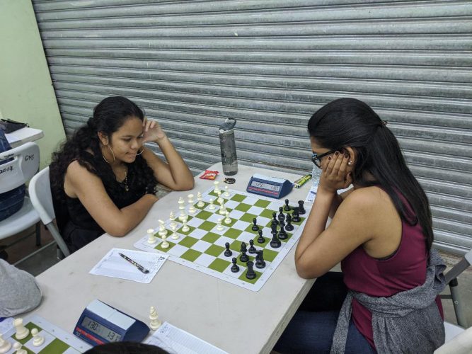 Sasha Christina Shariff (left) competing against Yolander Persaud at the 2020 Women’s Chess Championship Qualifier Tournament. Both players represented Guyana at the 2020 Online Olympiad.
