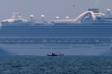 FILE PHOTO: A fishing boat sails past the Princess Cruises’ Ruby Princess cruise ship as it docks in Manila Bay during the spread of the coronavirus disease (COVID-19), in Cavite city, Philippines, May 7, 2020. REUTERS/Eloisa Lopez