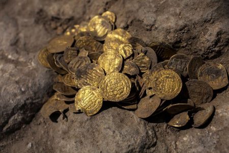 A hoard of gold coins, said by the Israel Antiquities Authority to date to the Abbasid dynasty, is seen after its discovery at an archaeological site in Central Israel