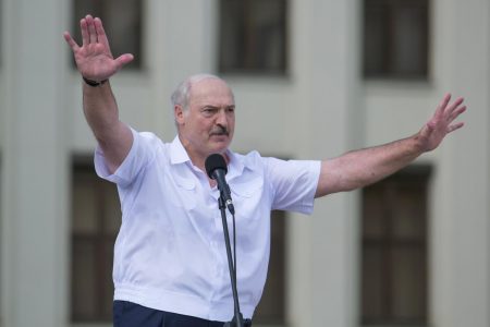 Belarusian President Alexander Lukashenko gestures as he delivers a speech during a rally of his supporters near the Government House in Independence Square in Minsk, Belarus August 16, 2020. REUTERS/Stringer