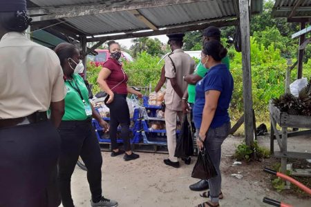 Officials from the Ministry of Public Health and the police during the exercise yesterday morning (Photos taken from West Demerara Police-Region 3 Facebook page)
