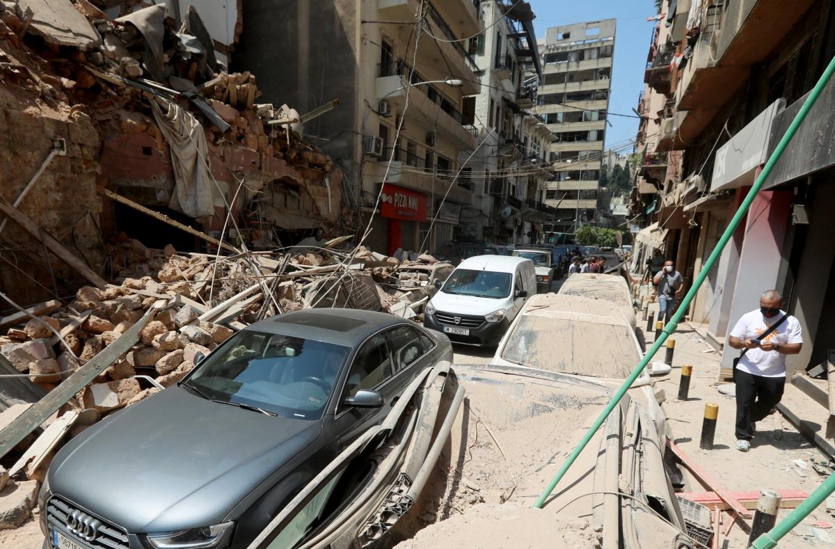 Vehicles drive past damaged buildings and cars following Tuesday’s blast in Beirut’s port area, Lebanon August 5, 2020. REUTERS/Mohamed Azakir