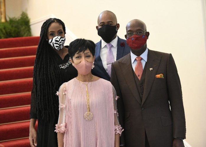 SECOND TIME AROUND: Newly reappointed Prime Minister Dr Keith Rowley and his wife, Sharon, pose for a family photo at President’s House yesterday with their daughter, Tonya Rowley-Cuffy, and son-in-law Kareem Cuffy. –Photo: JERMAINE CRUICKSHANK