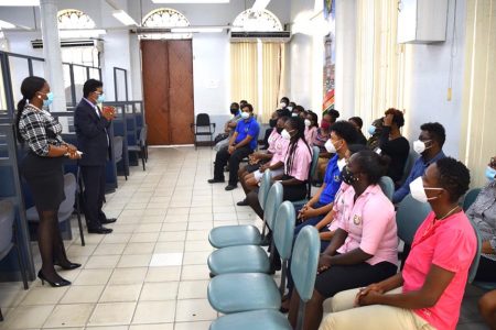 Attorney General Anil Nandlall (standing second from left) addressing the staff of the Deeds Registry (Ministry of Legal Affairs photo)