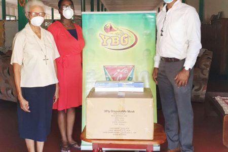 Sister Claudette Jones and Ms. Tracy Williams of St Ann’s Orphanage receiving 2000 face masks.
