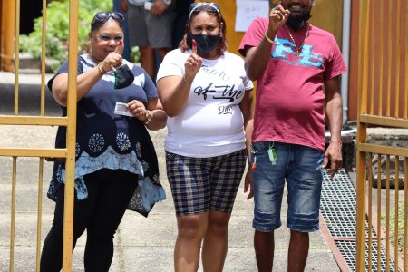 This family of three show their fingers after they voted at the St Joseph Government Primary School during last Monday’s General Election. The recount process in that constituency is now holding up the ratification of the final results.