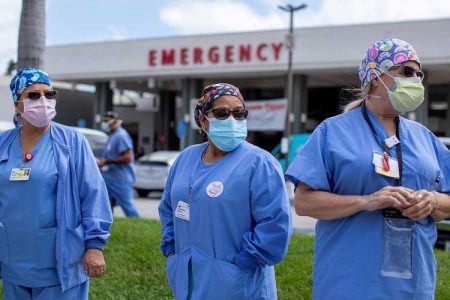 Healthcare workers at Fountain Valley Regional Hospital hold a rally outside their hospital for safer working conditions during the outbreak of the coronavirus disease (COVID-19) in Fountain Valley, California, US, August 6, 2020. Image Credit: Reuters