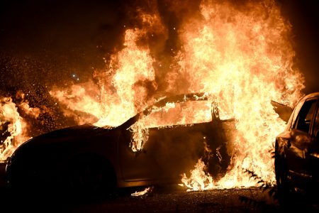 Cars burn in a lot as protests turn to fires after a Black man, identified as Jacob Blake, was shot several times by police Sunday night in Kenosha, Wisconsin, U.S. August 24, 2020. Picture taken August 24, 2020. REUTERS/Stephen Maturen