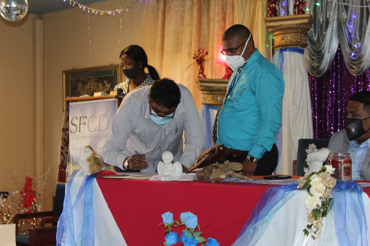 David Armogan signing his instrument of appointment
