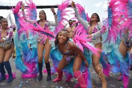 BLISSFUL FUN: Revellers of the mas band Bliss cross the Socadrome stage for Carnival 2020 at the Hasely Crawford Stadium, Port of Spain. —Photo: DEXTER PHILIP