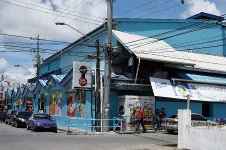 Taken away: Co$$ Cutters supermarket in Sangre Grande where businesswoman Mary Ali was kidnapped yesterday in the car park of the supermarket by two men.