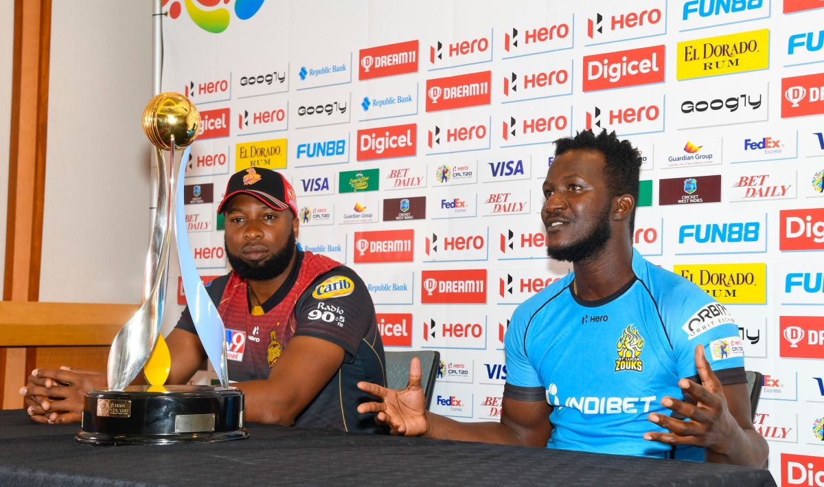 Former West Indies captain and skipper of St Lucia Zouks, Darren Sammy, right, makes a point at the Zoom press conference yesterday while TKR skipper Kieron Pollard awaits his turn. (Photo courtesy CPL media)
