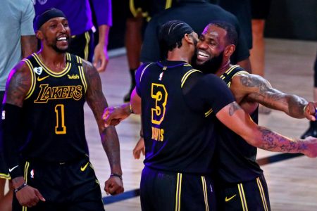 LeBron James embraces Anthony Davis after the latter’s buzzer-beating, three-pointer, lifted the Los Angeles Lakers to a 105-103 win  in the second game of the best of seven Western Conference Finals.(Photo courtesy Reuters/USA Today)