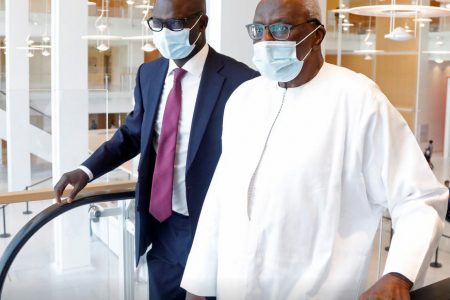 Former president of the International Amateur Athletics Federation Lamine Diack, right, arrives with his lawyer Simon Ndiaye for the verdict of his trial at the Paris courthouse, France yesterday. (Reuters photo)
