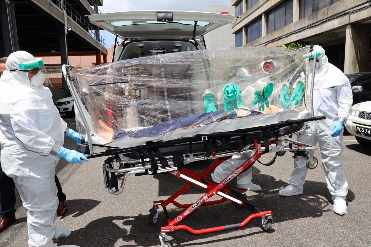 FLASHBACK: Global Medical Response of Trinidad and Tobago (GMRTT) employees during a demonstration exercise of how to transport a COVID-19 victim back in March this year.