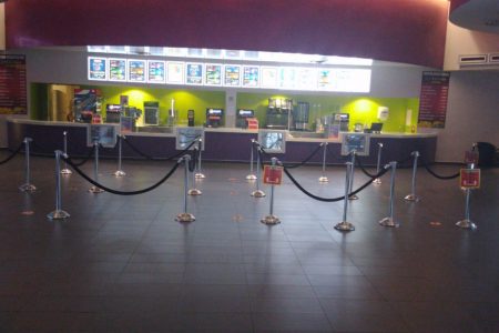 Distancing stickers in front of Caribbean Cinemas indicating where customers should stand
