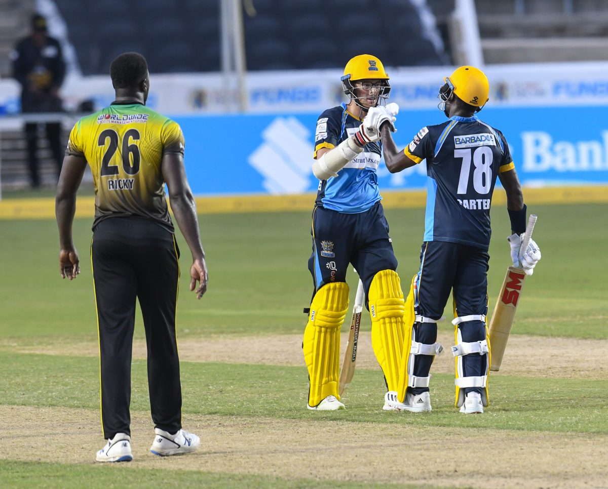 Mitchell Santner, second right) and Jonathan Carter, celebrate their team’s defeat of the Jamaica Tallawahs yesterday in the Hero Caribbean Premier League competition.(Photo Randy Brooks- CPLT20 Getty Images)