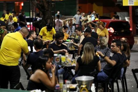 People enjoy at a bar after a Manaus City Hall decree that determined the closure of bars and restaurants was issued, amid the coronavirus disease (COVID-19) outbreak in Manaus, Brazil, September 25, 2020. REUTERS/Bruno Kelly/File Photo