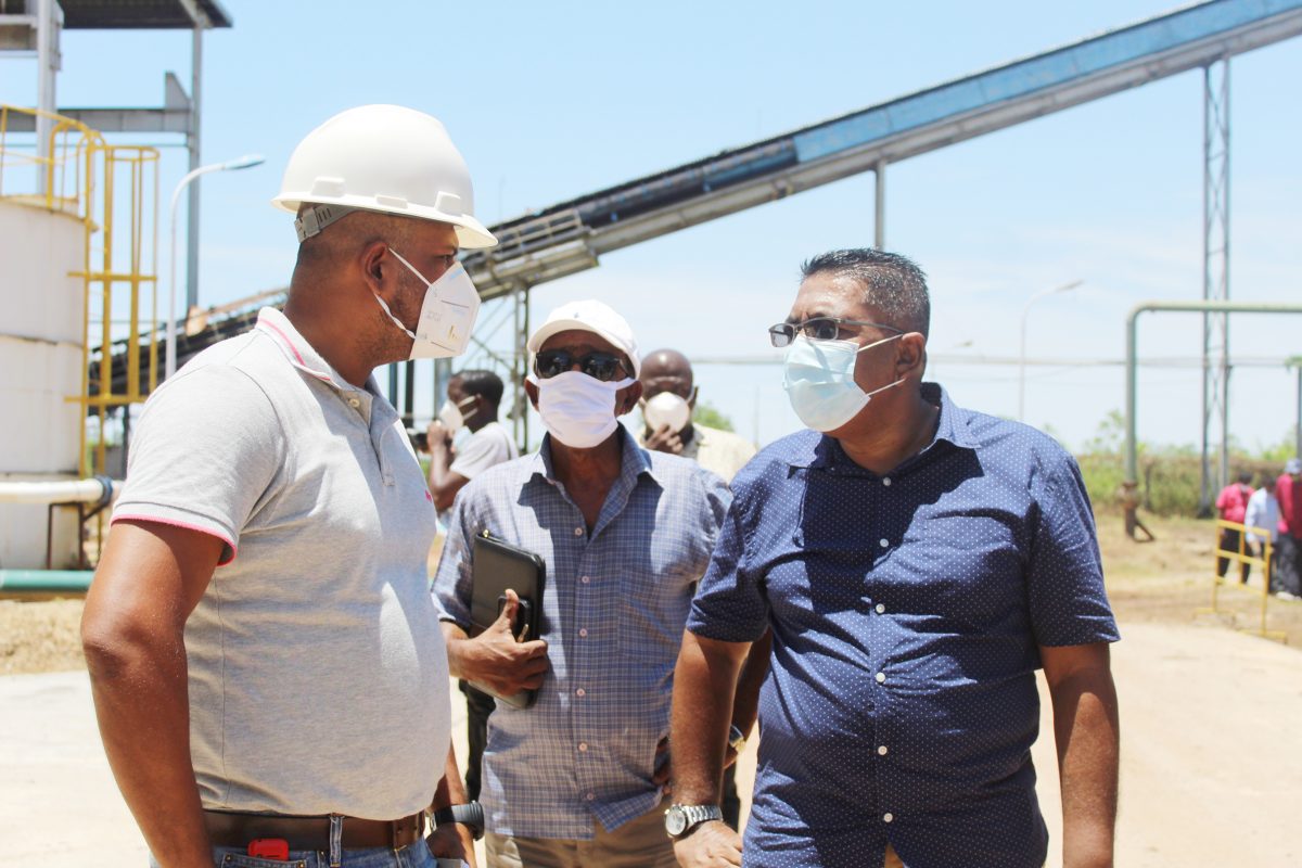 Minister of Agriculture Zulfikar Mustapha (right) at the Skeldon factory
